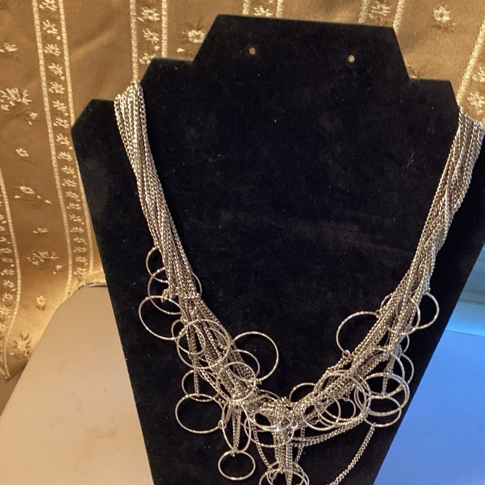 Elegant Silver Multi-Strand Necklace With Faceted Hoops